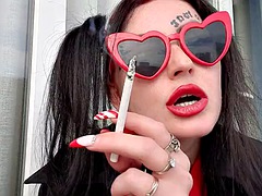 Sexy smoking fetish by Dominatrix Nika. Mistress smokes 2 cigarettes and blows smoke in your face. Sexy red lips