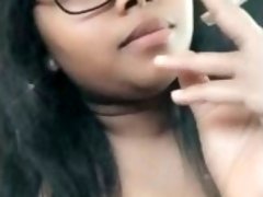 Nerdy  stoner girl In glasses smokes a blunt smoking fetish