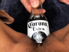 Kinky amateur wife using a beer bottle to please her pussy